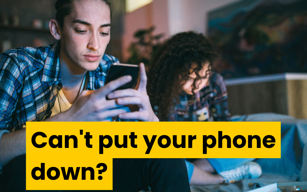 Young man and young woman sitting beside each other in a living room. Each is staring intensely at their phone. They aren't talking to or looking at each other. Text reads can't put your phone down?