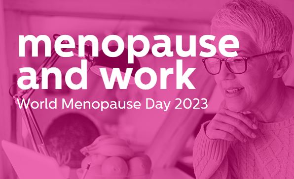 women looking at laptop on desk. Pink filter over with the words saying menopause and work- world menopause day 2023